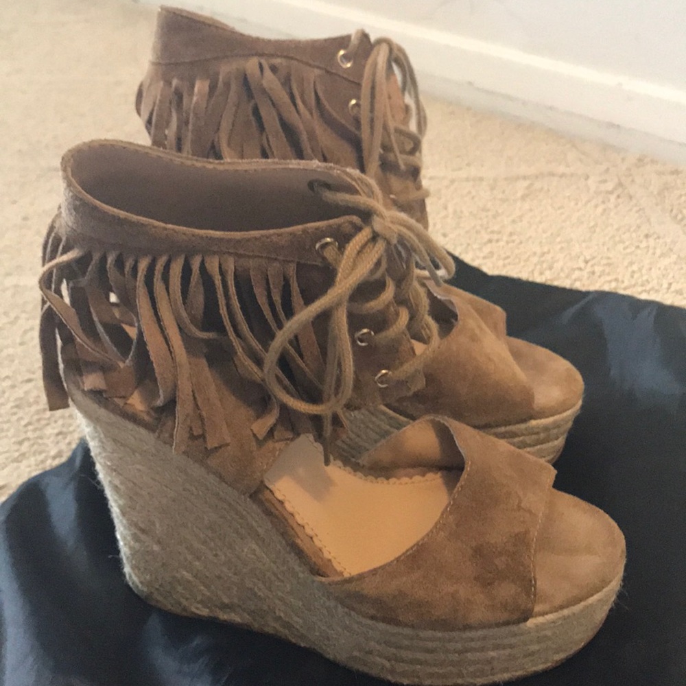 Lace up wedge with trim around the ankles